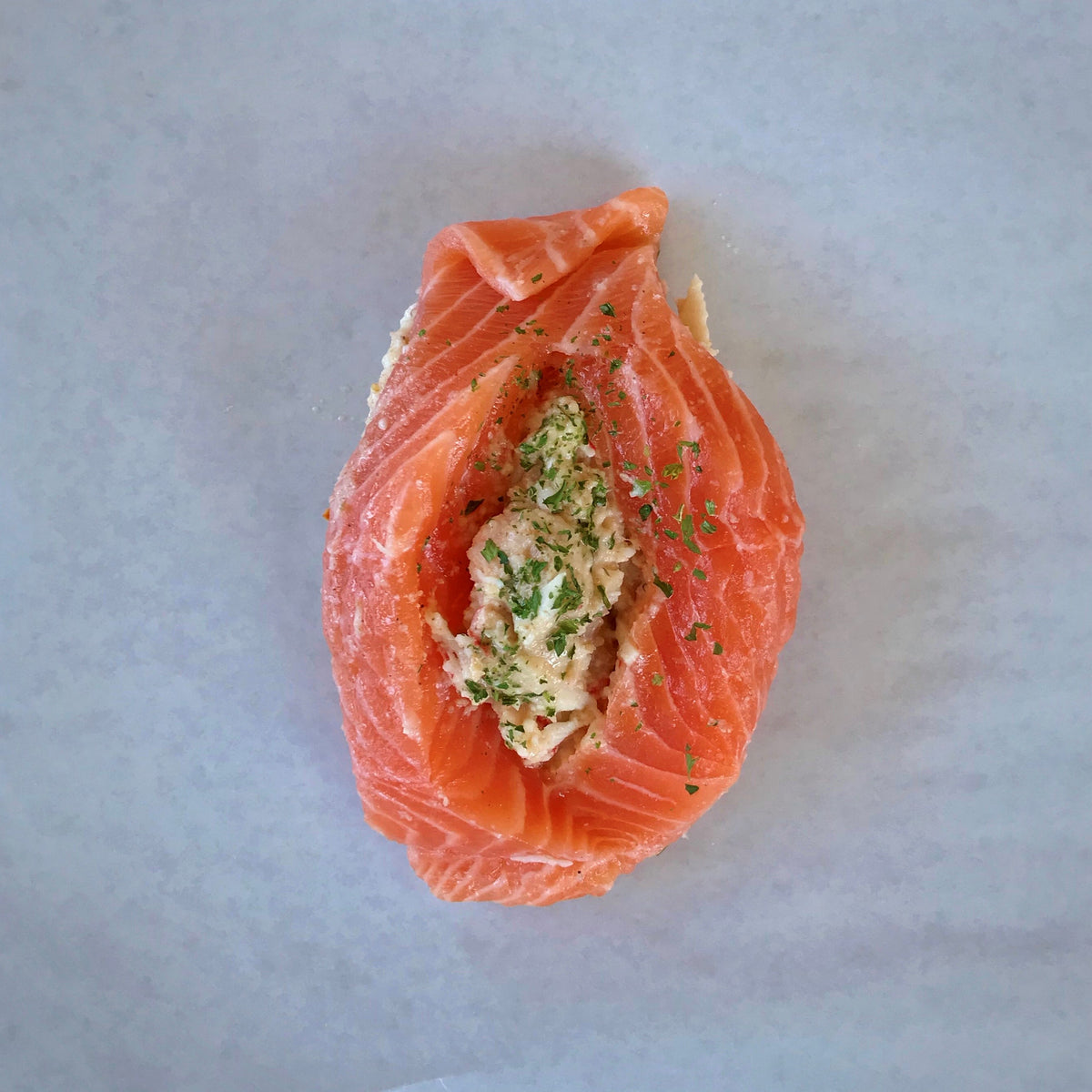 https://cdn.shopify.com/s/files/1/0588/8527/5820/products/Raw-Stuffed-Salmon-portion_1200x.jpg?v=1656422724