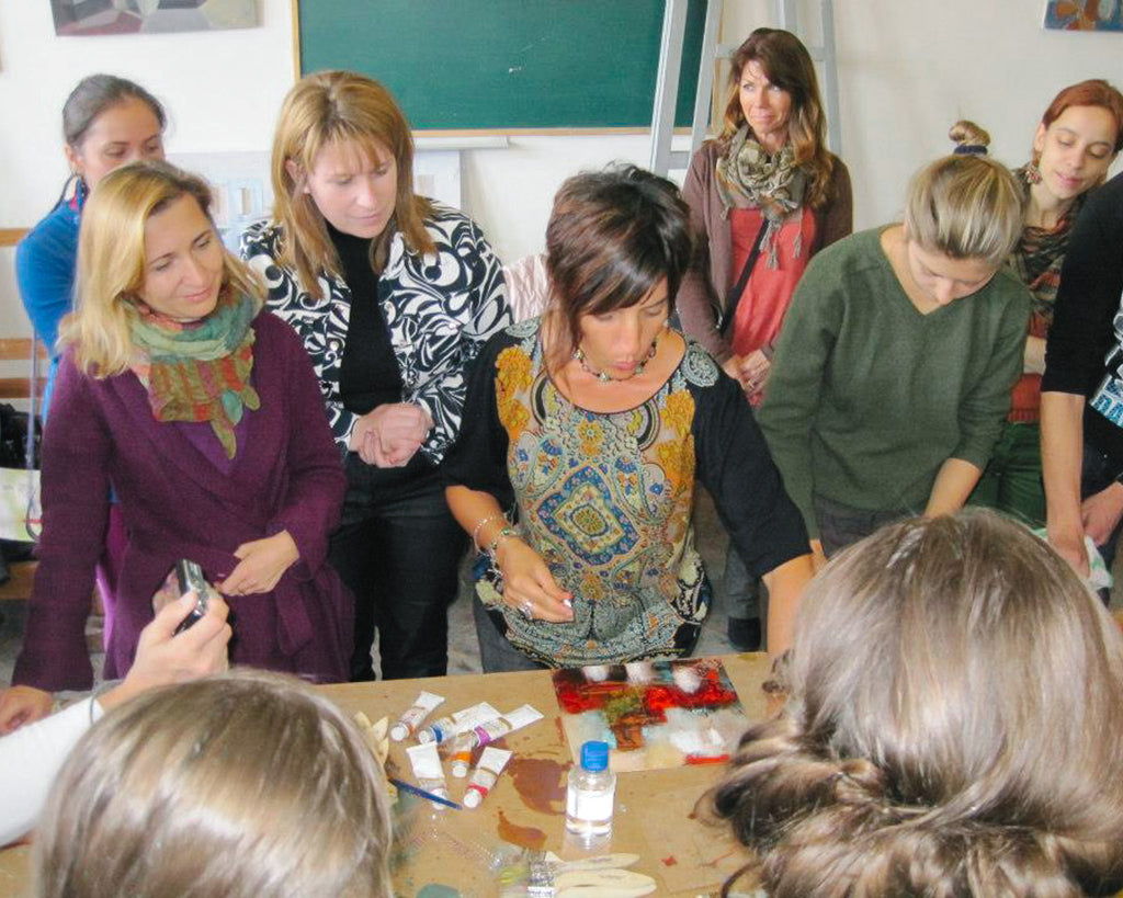 Artist educator, Elli Milan, teaches a mixed media workshop in Uzghorod, Ukraine