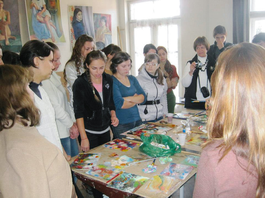 Artist educator, Elli Milan, teaches a mixed media workshop in Uzghorod, Ukraine