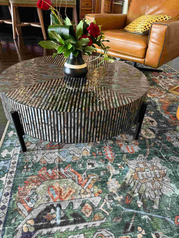 Elli's black and white striped table sits in the middle of her living room, which perfectly reflects her personal aesthetic.