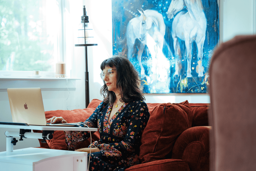 Lifestyle image of Artist Elli Milan on her Mac Laptop 