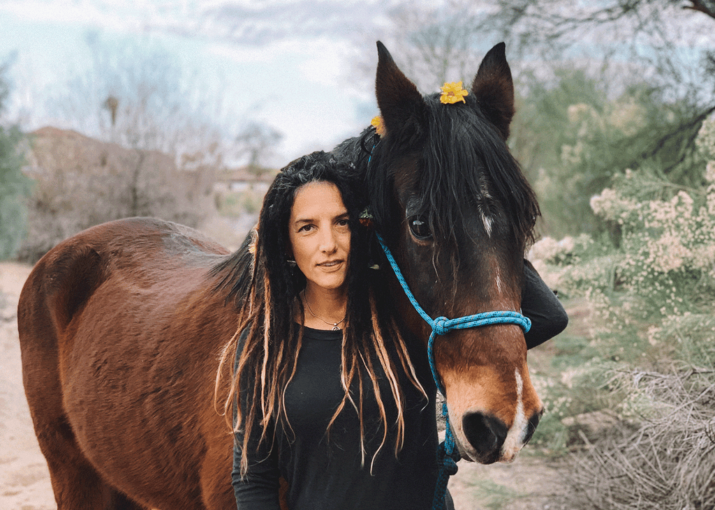 Elli Milan standing next to her horse Beau