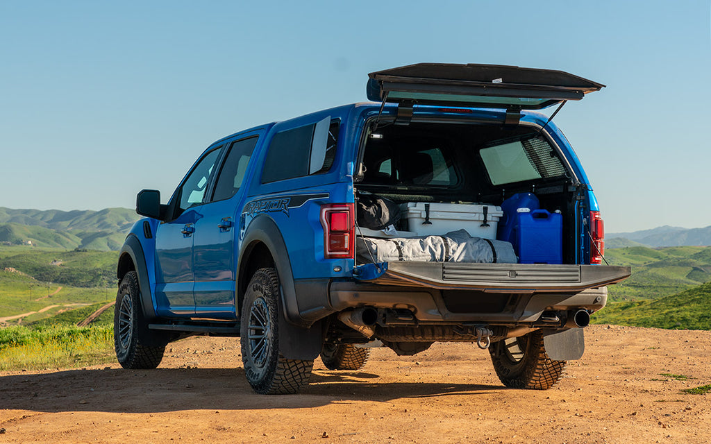 blue ford raptor with gear