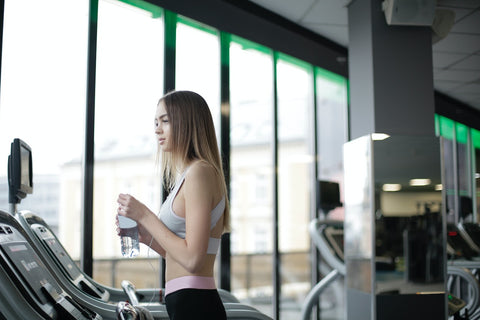 Female on a treadmill looking out of long window