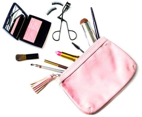 Makeup bag with brushes and spilling out