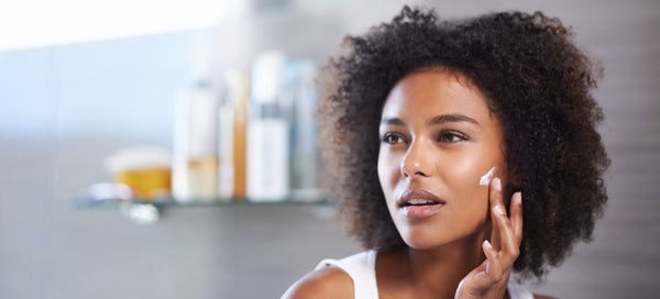 Woman applying serum