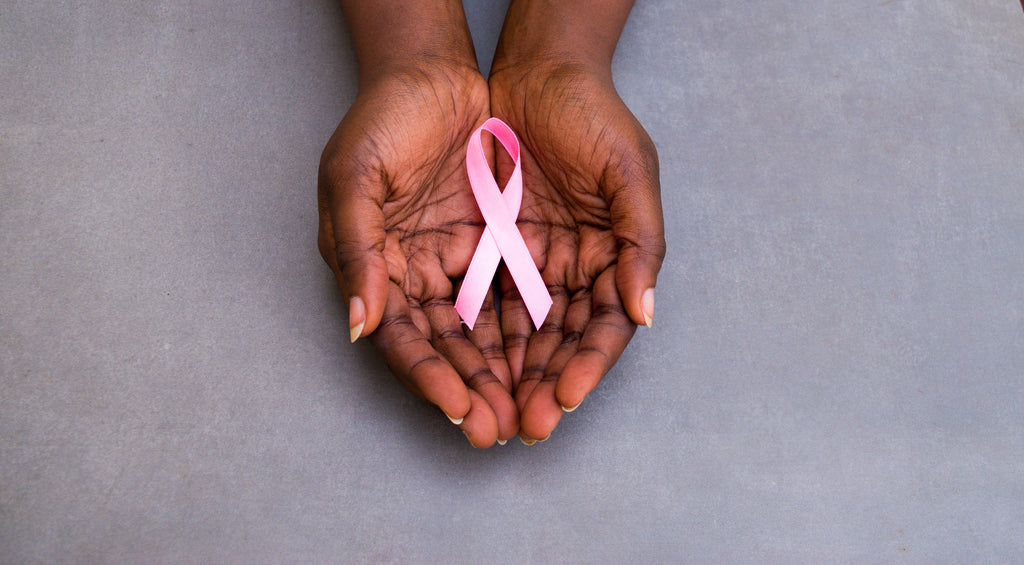 Hands Holding Pink Ribbon