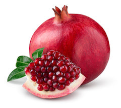 Pomegranate fruit with a slice showing pomegranate seeds