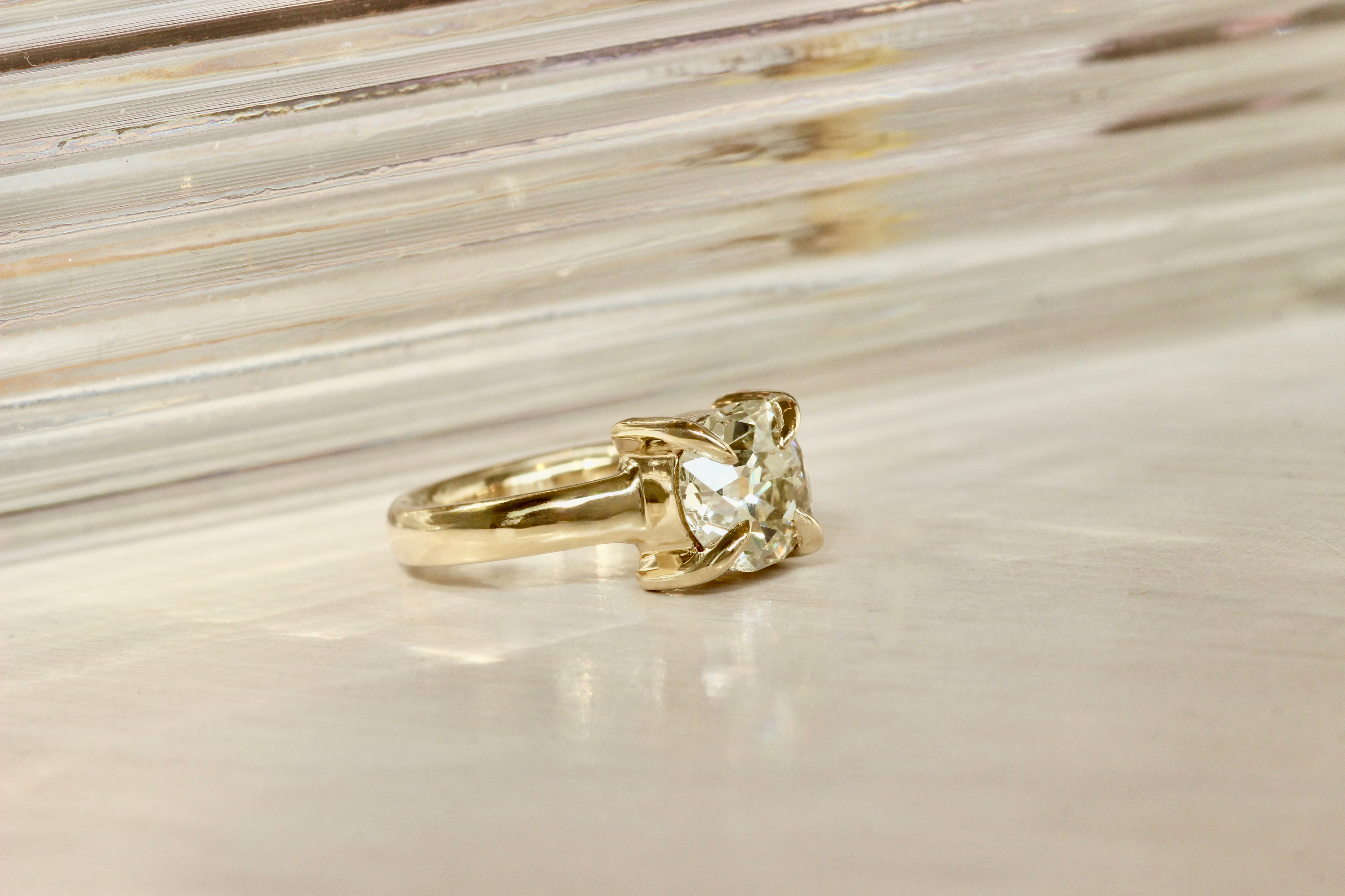 Front view of Adriana + Mike's custom engagement ring by Goldpoint Jewelry in Greenpoint, Brooklyn.