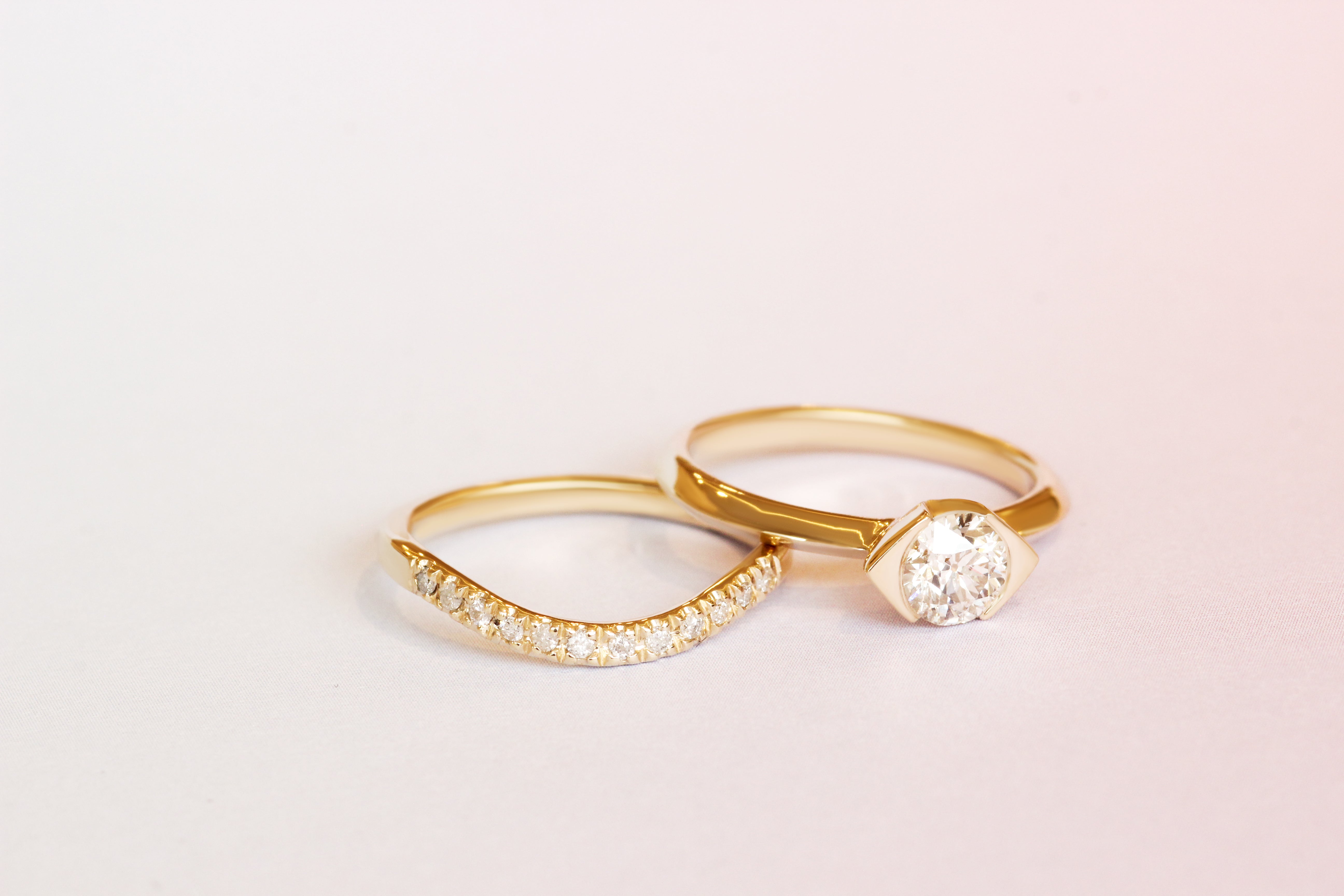 Hand view of Olivia + Raymundo's custom rings by Goldpoint Jewelry in Greenpoint, Brooklyn.
