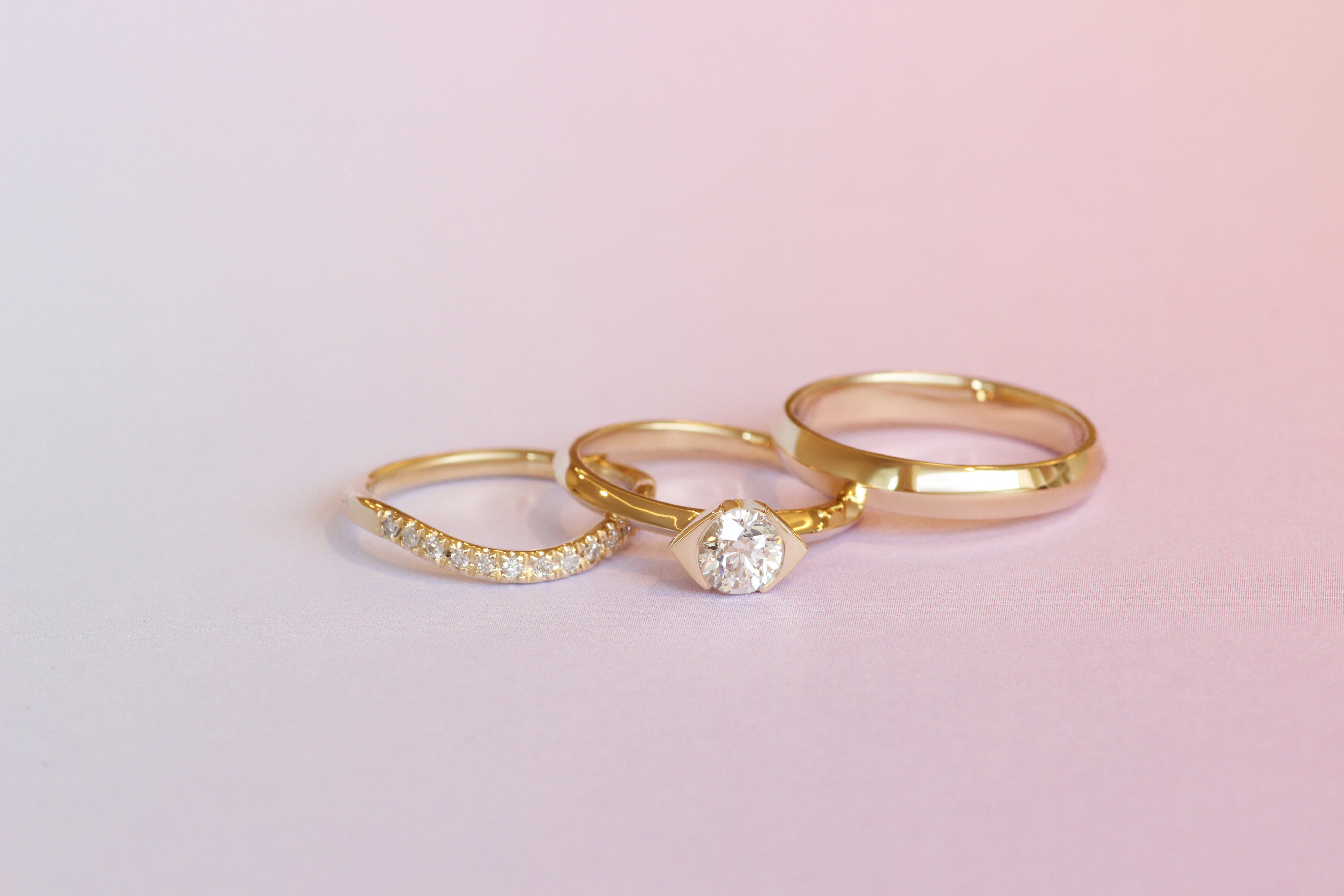 Hand view of Olivia + Raymundo's custom rings by Goldpoint Jewelry in Greenpoint, Brooklyn.