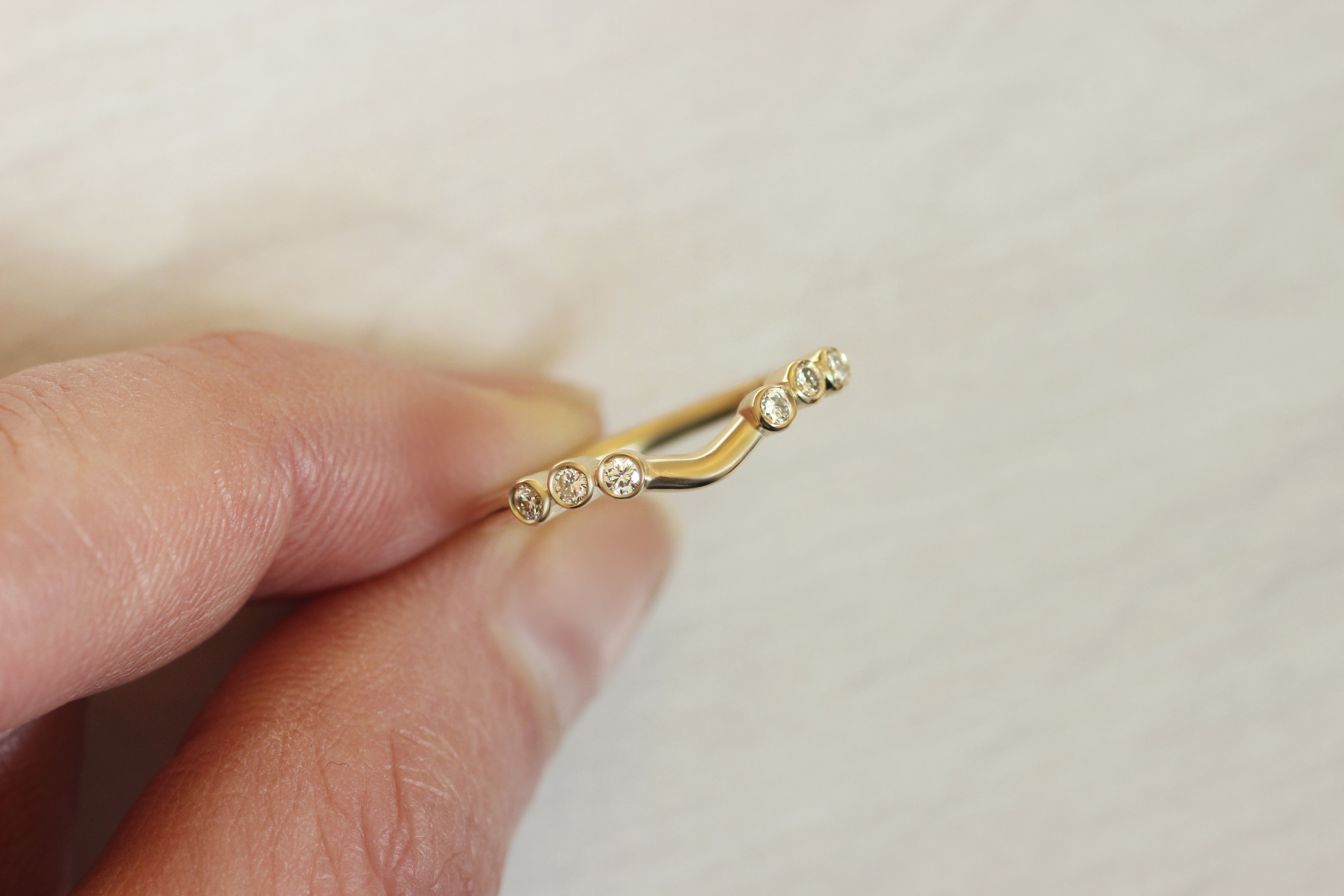 Close view of Kelly + Richie's custom ring by Goldpoint Jewelry in Greenpoint, Brooklyn.