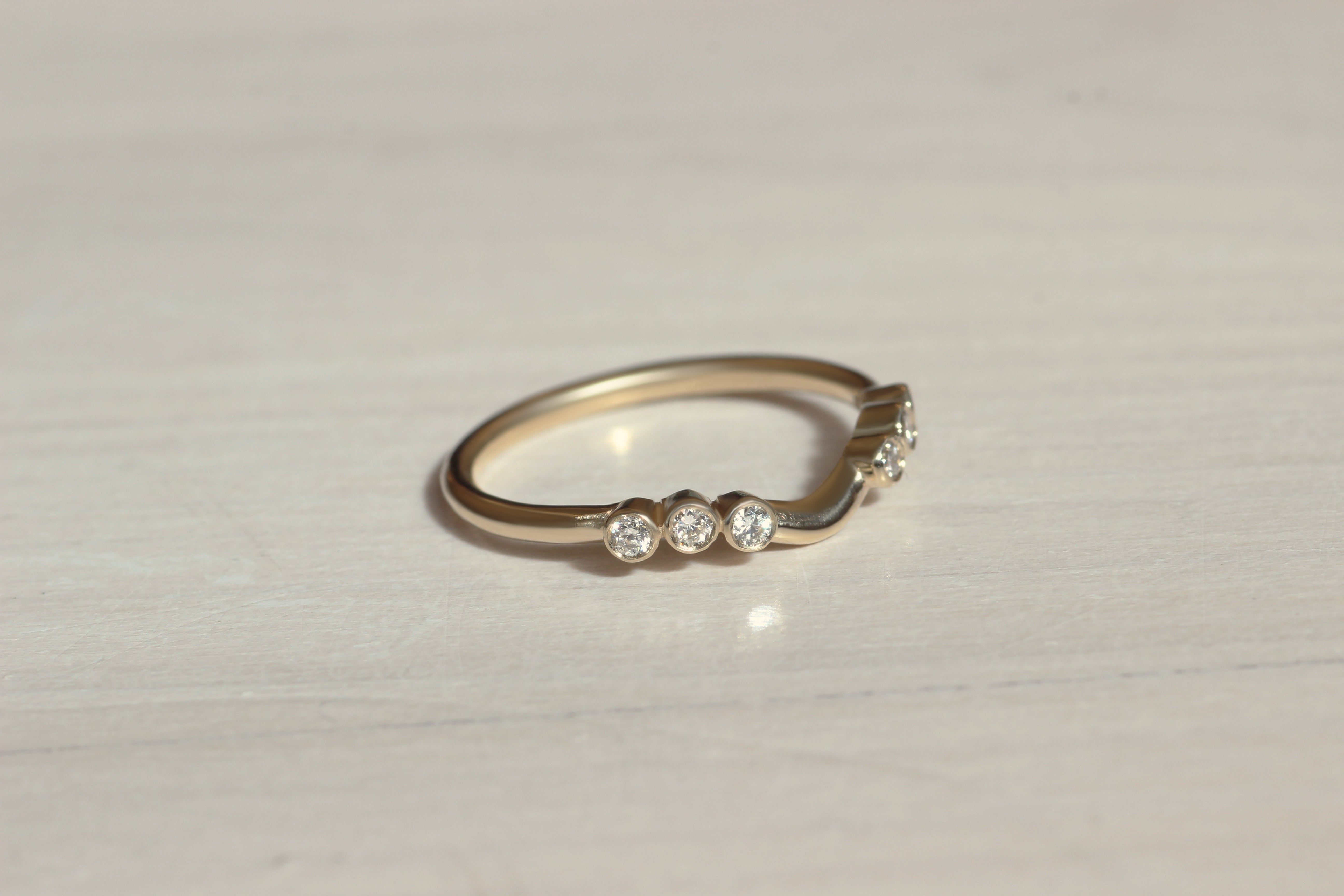 Front view of Kelly + Richie's custom ring by Goldpoint Jewelry in Greenpoint, Brooklyn.