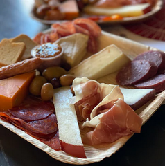 Cheese plate featuring 5 artisan cheeses and 4 types of charcuterie