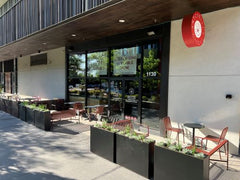 Exterior of space showing picnic tables and chairs