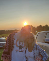 Cheesemonger and a Friend standing in front of a sunset at Bethel Woods, NY