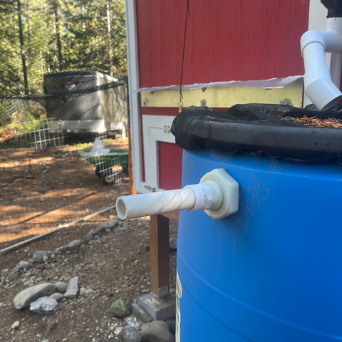 Rain barrel overflow pipe