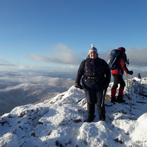 fat woman standing on a snowy mountain