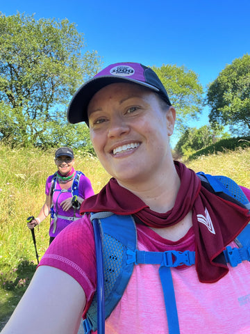 woman hiker wearing a cooling towel around her neck