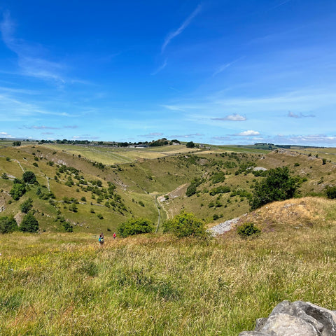 a view of hills and blue skies