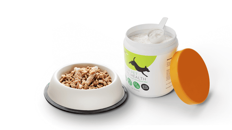 Bowl of dog food next to Super Pet Total Health prebiotic powder