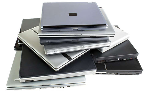 stack of refurbished laptops