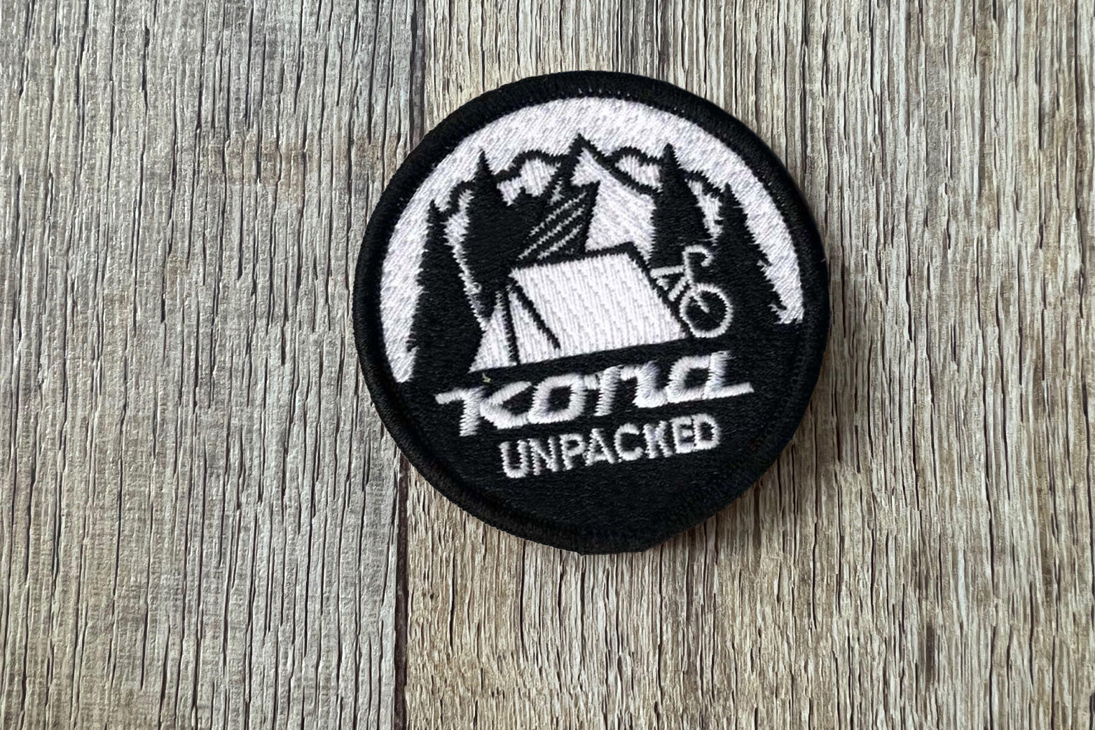 Kona Unpacked patch on wood