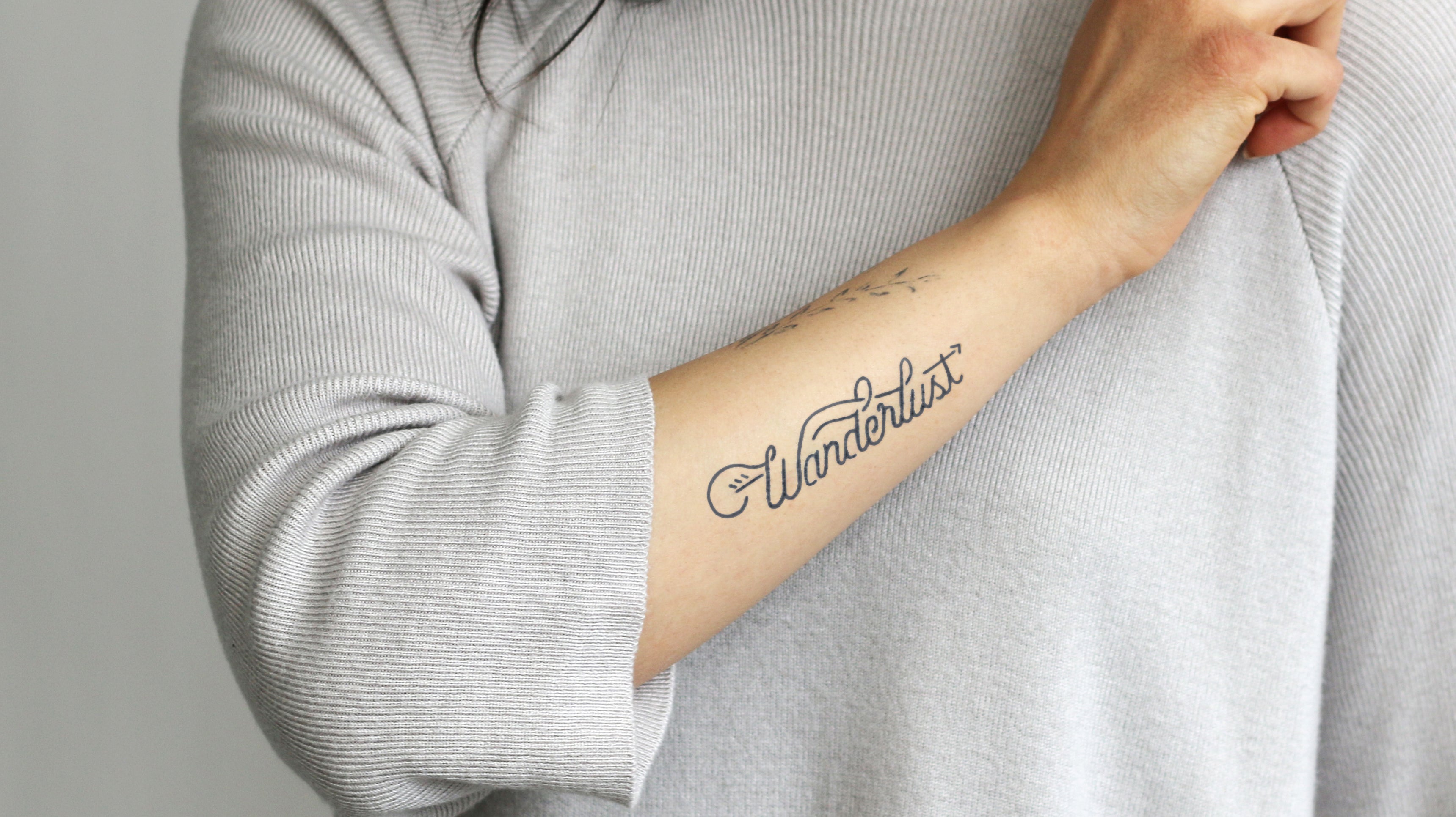 wanderlust definition tattoo