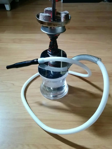 apart from being a table top hookah. you may see its being used a floor shisha as well. DRMA HMD Device, silicon pipe and good quality coconut charcoals are here.