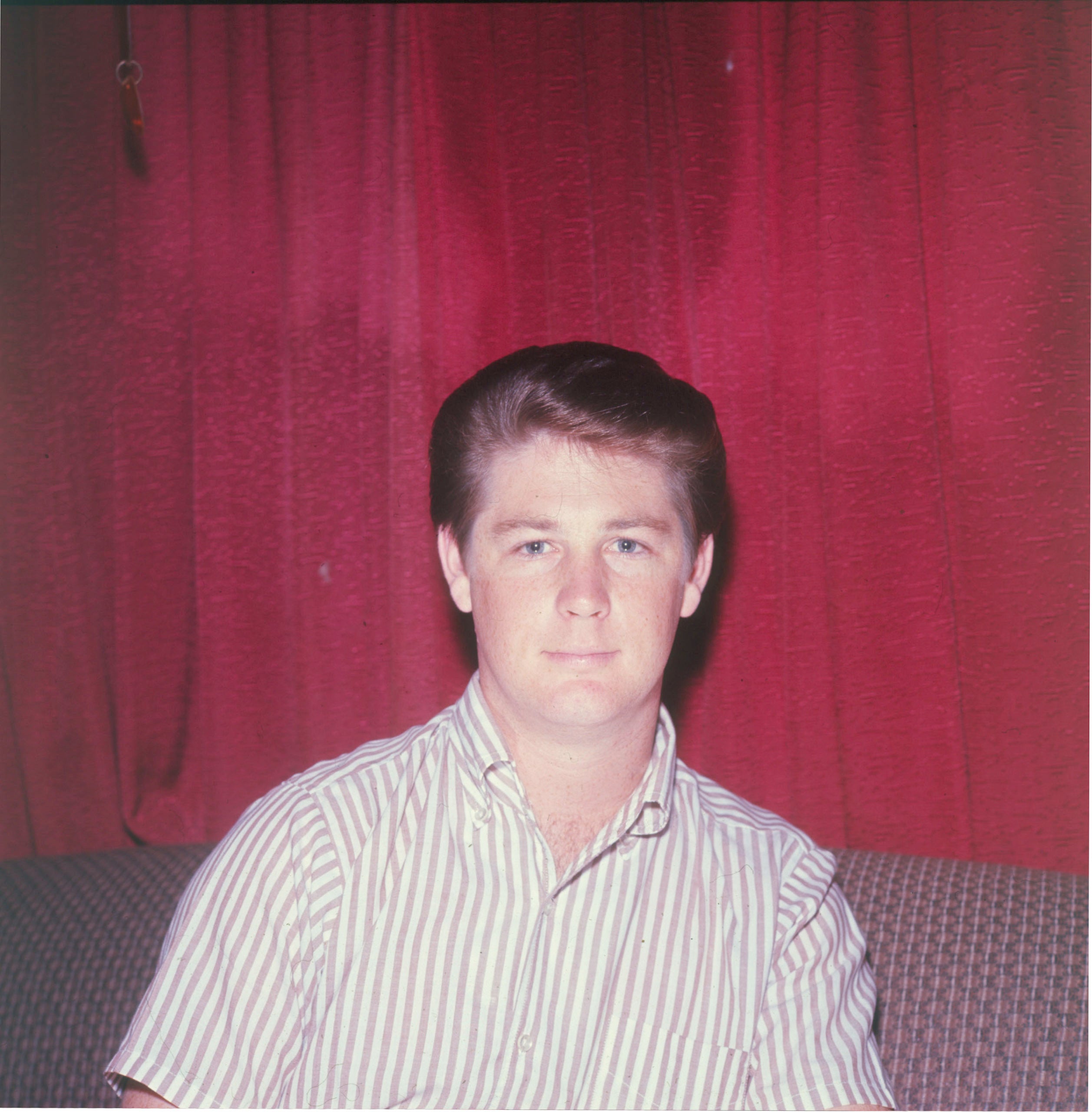Brian Wilson portrait with red back ground