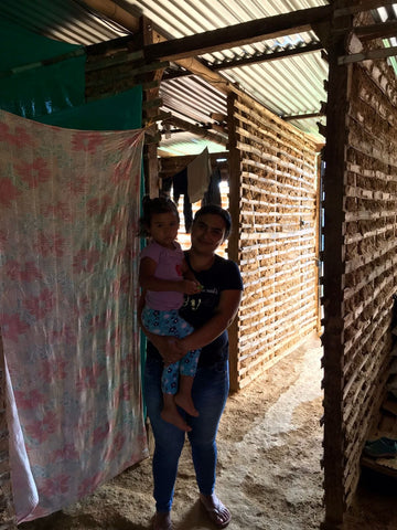 Denis in her house with her daughter