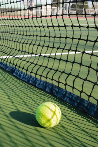 tennis ball near net