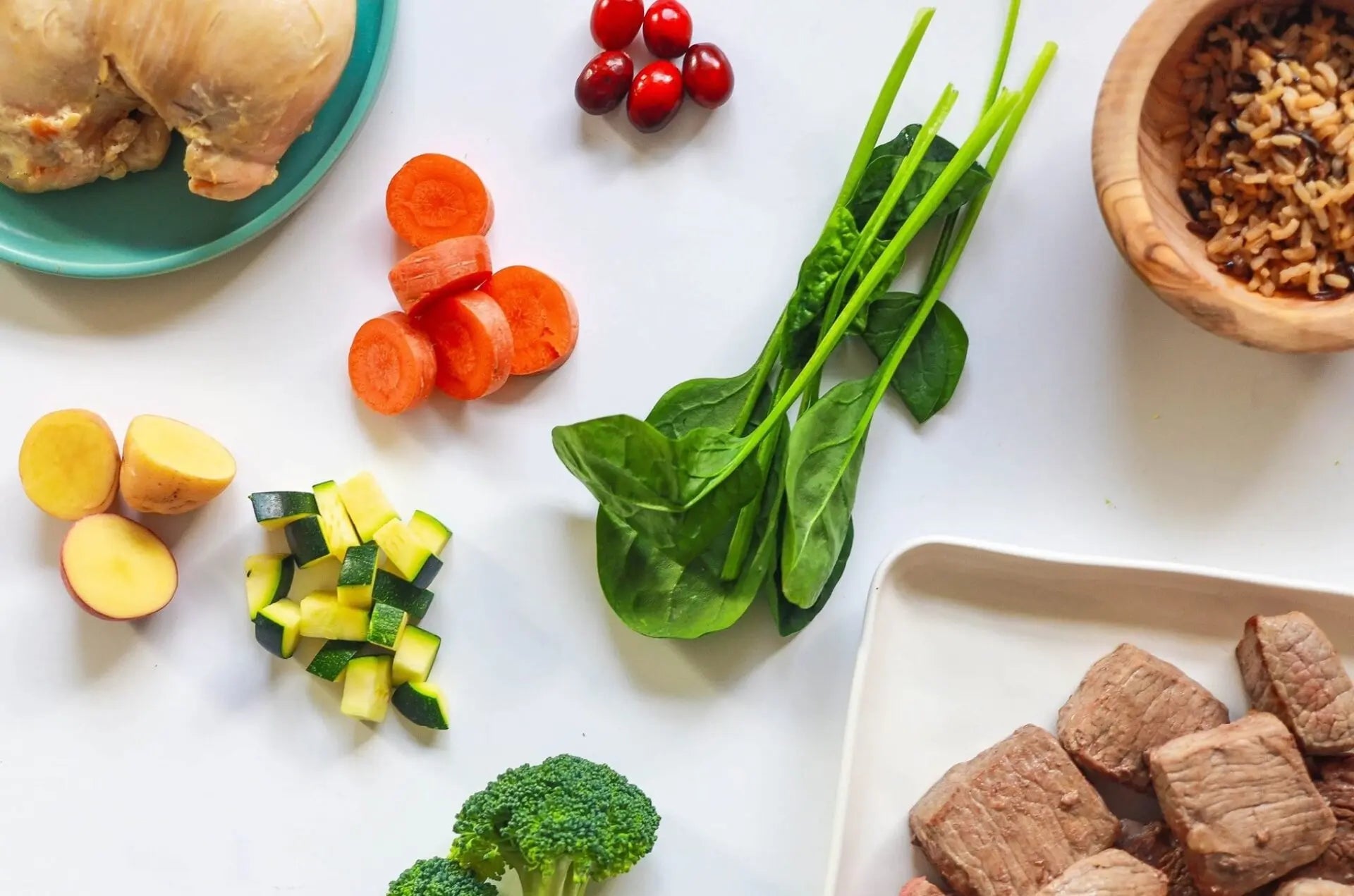 Variety of fresh whole foods including meats and veggies