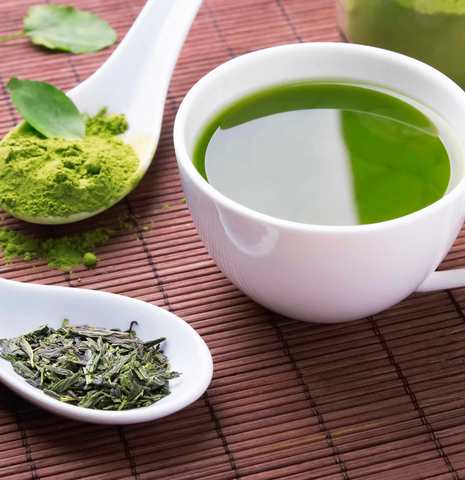 Matcha tea with matcha powder and leaves