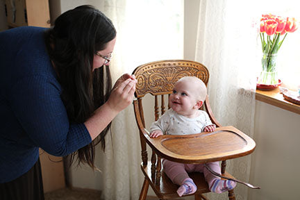 mom signing to baby girl