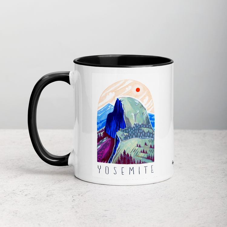 White ceramic coffee mug with black handle and inside; has Yosemite National Park illustration by Angela Staehling
