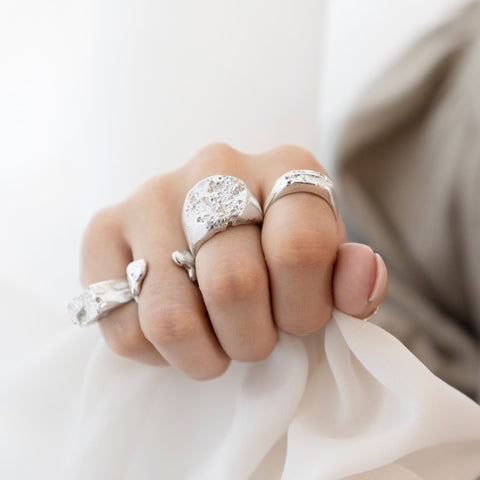 Model wearing recycled silver Earth Cast rings by Jo Wood