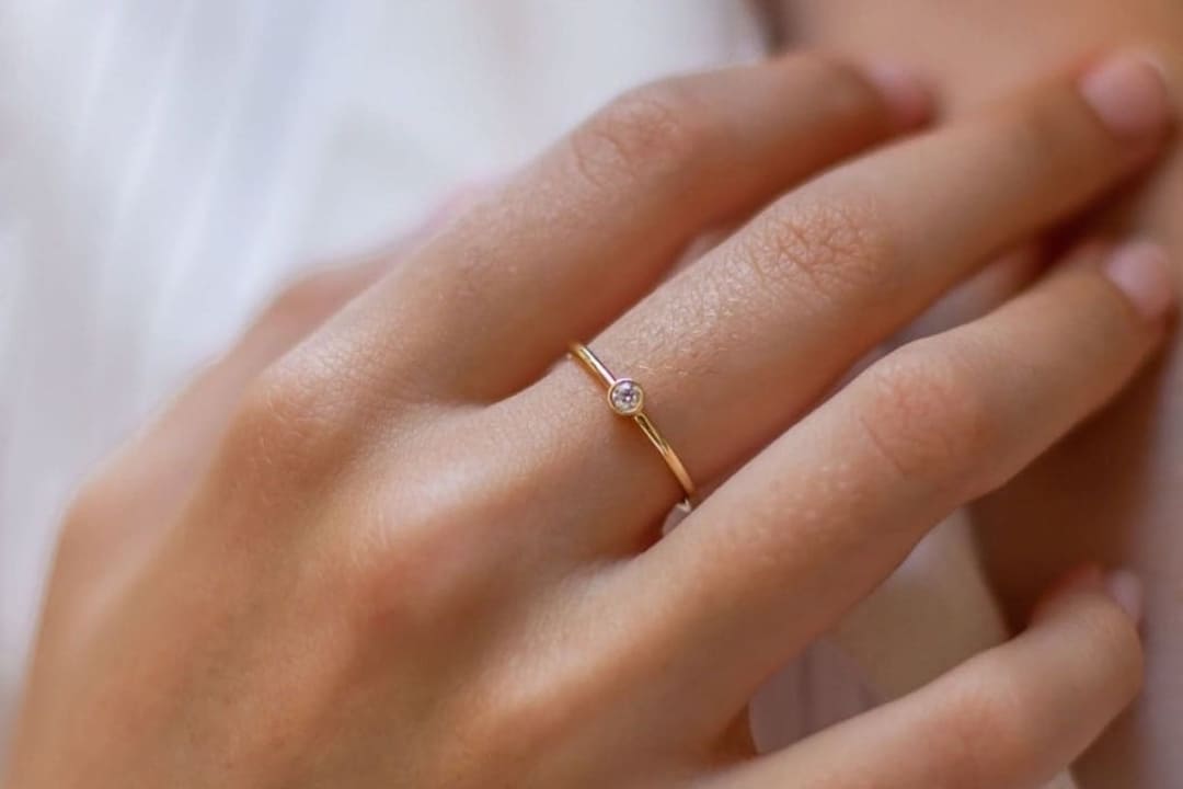 Bezel-set gemstone ring by Lily Flo