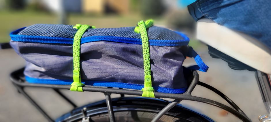 ROK Straps make carrying a camp chair to the park easy on a bicycle.