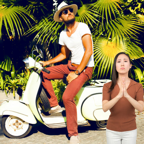 Attractive woman saying please near a male tourist on motorbike, palm trees in back