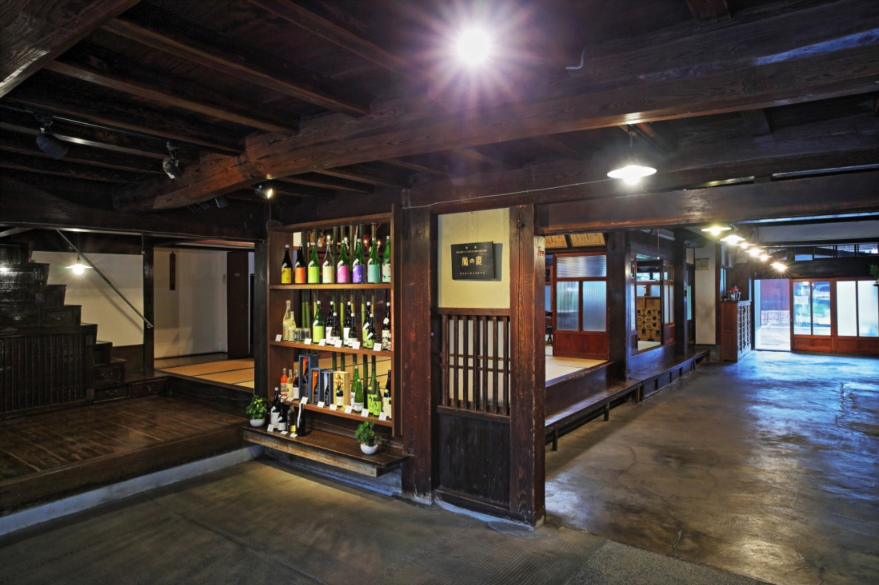 Niwa no Uguisu brewery-- an old, wooden, traditional tasting room with beautiful modern bottles. from Madamesake.fr