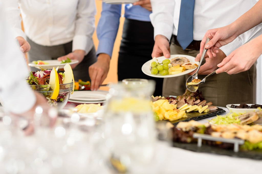 guests self-serving appetizers at a party