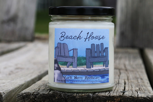 beach house soy candle sitting on a wooden dock