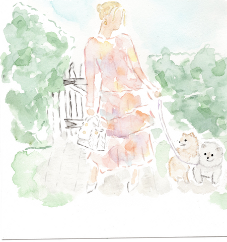 lady in garden with two dogs