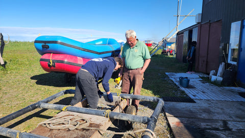 Owen repairing the raft trailer with Tony