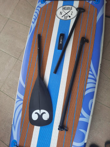 3 piece adjustable paddle dismantled on top of a Moana Kehu paddle board
