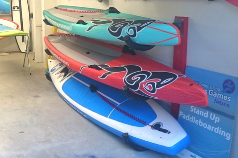 paddle boards on a rack in a garage