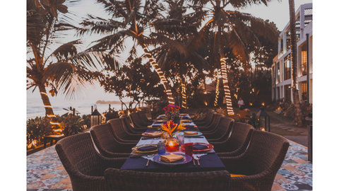 beachfront table with palm trees