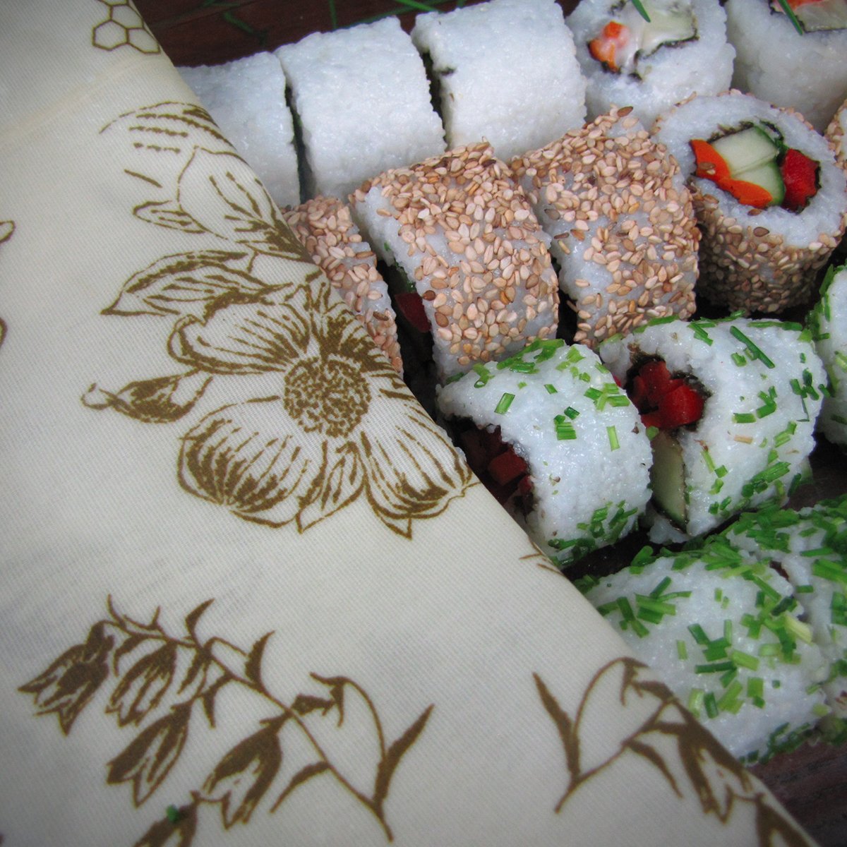 photo showing vegan sushi wrapped in beeskin beeswax wraps in XL size flower design