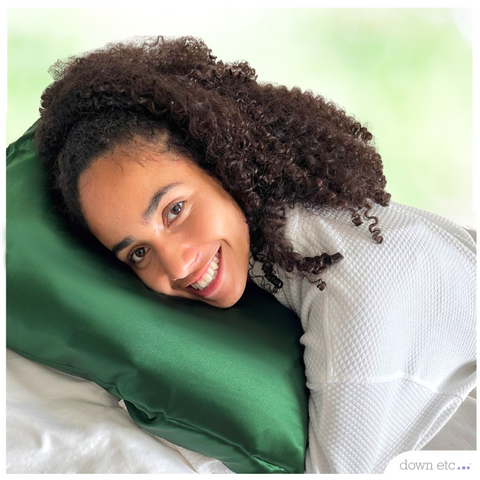 girl on green silk pillow